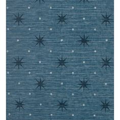 a blue and white rug with black stars on the top, in rows of dots