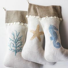 three christmas stockings with sea creatures on them