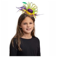 Skeleteen Purple Top Hat Headband is the perfect accessory for Mardi Gras. The hat is 5 inches long and has colorful feathers and sequins. the headband has comb like ridges to secure it on your head. This cute hat can also be worn for Halloween and will make a great statement at any party. Give this headband to a child who loves pretend play and dress up, and he will be ecstatic with the new addition to his costume chest! The headband is made of high quality materials. Fun Adjustable Carnival Headpiece, Adjustable Headband Costume Hats For Carnival, Adjustable Mini Hat For Mardi Gras Costume Party, Adjustable Novelty Headpieces For Carnival, Adjustable Carnival Costume Hats And Headpieces, Novelty Adjustable Headpiece For Carnival, Carnival Hat Headpiece, Adjustable Multicolor Mini Hats For Costume Party, Adjustable Round Crown Hat For Carnival