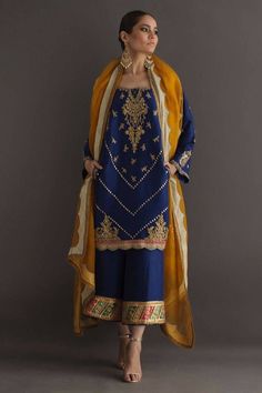 Pure hand made royal blue silk kurta straight shalwar kameez set along with rusht yellow dupatta, Needle and thread work embellished with pearl and zari on flair of the kameez,slit sleeves and neck, trouser with chatapati gota lines and leaves, Dupatta pure organza color with golden scallops design over all the dupatta 💯% fabric gauranteed, work guaranteed There might be slightly colour changes variation due to different colour settings, We do not sell replica, we made 100% hand made customised Pakistani Dresses Party, Velvet Dress Designs, Pakistani Fashion Party Wear, Beautiful Pakistani Dresses, Silk Kurta, Party Kleidung, Simple Pakistani Dresses, Designer Party Wear Dresses, Boutique Dress Designs