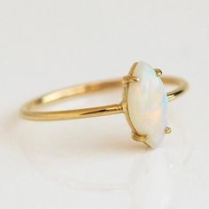 Dainty minimalist opal ring, prong setting, 18k gold plated over sterling silver. Adjustable Gold Opal Ring Fine Jewelry, Gold 14k Opal Ring As Gift, 14k Gold Opal Ring For Gift, Everyday 14k Yellow Gold Opal Ring, Gold Opal Ring With Birthstone, Gold Opal Birthstone Ring, Minimalist Gold Opal Birthstone Ring, Gold Opal Open Ring Dainty Style, Dainty Gold Opal Ring In 14k