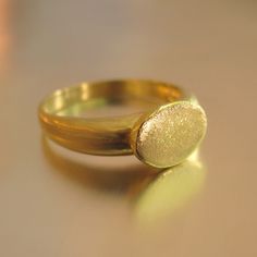 The Ring Made From 14 Karats Yellow Gold. Width Of The Signet: 0.35x0.43inch/ 9x11mm. Ring Width In The Wide Section: 0.15inch/ 4mm. In Figures 7 And 10 You Can See A Different Example Of A Signet Ring, Also In A White Gold. Signet Ring For Men. Signet Ring For Women. Unique And Special 14-Carat Gold Signet Ring. This Classy And Beautiful Ring Band Will Always Look Great. Delicate Signet Ring With A Flat Head A Classy And Unique Presence. Available In All Sizes, Color Gold, And Karat. Gold Dome Ring With Smooth Bezel In 14k Gold, Formal Yellow Gold Jewelry With Smooth Bezel, Untreated Yellow Gold Signet Ring As Gift, Yellow Gold Ring With Polished Finish In Recycled Gold, Gold Ring With Smooth Bezel For Formal Occasions, Recycled Yellow Gold Rings With Polished Finish, Yellow Gold Rings With Polished Finish In Recycled Gold, Yellow Gold Signet Ring For Anniversary, Minimalist Yellow Gold Signet Ring With Bezel Setting