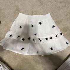 White Star Skirt New Without Tags White Casual Mini Skirt For Party, Trendy White Flared Mini Skirt, Trendy White Flared Skirt, White Star Print Summer Bottoms, Summer White Star Print Bottoms, White Summer Bottoms With Star Print, Trendy White Tiered Skirt, Trendy White Tiered Skort, Star Skirt