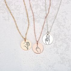 Treat your loved ones to something totally unique, totally creative, and totally YOU - the Hand Gestures Necklace. The perfect gift to let your friends and family know how much they truly mean to you! The coolest gift ever! Perfect for sharing your love with friends, sisters, and besties, our signature disc necklace features unique, hand-drawn expressions of sign language, designed by Melanie. Show your special someone just how much you care with a one-of-a-kind sign like 'I love you', 'peace', Elegant Engraved Charm Necklace For Best Friend, Engraved Pendant Charm Necklaces For Best Friend, Engraved Pendant Necklace For Friendship, Heart-shaped Engraved Charm Necklace For Best Friend, Personalized Heart-shaped Necklaces For Friendship, 20 Inch Necklace, Princess Necklace, Wear Necklaces, Month Gifts