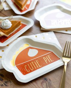 there is a piece of pie on the plate with gold fork and napkins around it