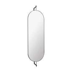 an oval mirror hanging on the wall next to a black hook in front of it