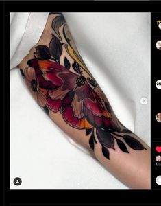 a woman's arm with flowers on it