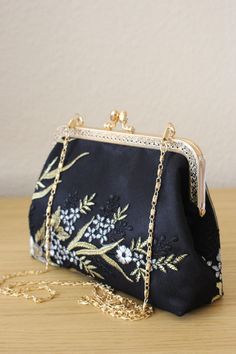 Black and Golden bag for Wedding guest.  Elegance, style and originality are the key parts of these creations. The use of quality materials, advanced know-how are essential values to offer you the best creations. What are you waiting for to sublimate yourself and being original, come to discover our large collection of evening bags. Our collection of Floral golden Black bag made in France.  Bridal clutch for wedding day. Inside French  silk/coton This bag  closed with Kiss-lock frame. - Height5, Elegant Gold Evening Bag With Floral Embroidery, Rectangular Embroidered Evening Bag For Wedding, Elegant Floral Embroidered Clutch Evening Bag, Gold Rectangular Evening Bag With Floral Embroidery, Black Pouch Clutch For Wedding, Gold Embroidered Wedding Clutch Bag, Elegant Embroidered Bags For Ceremony, Traditional Black Evening Bag For Wedding, Wedding Clutch Bag With Gold Embroidery