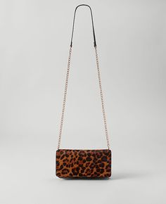 Our haircalf mini crossbody bag adds the perfect touch of animal intrigue. Foldover top. Chain handle. 8 1/2"L x 4 1/2"H x 1/14"W.,Imported:Imported,Fabrication:100% Real Fur/Cow Leather Haircalf Mini Crossbody Bag with Chain Strap by Ann Taylor Size regular - One Size Brown Multi Women's Bags, Clutches, Crossbody, Bags, 100%, Real, Fur/Cow, Leather Leopard Print Top Handle Bag With Gold-tone Hardware, Leopard Print Shoulder Bag With Detachable Strap For On-the-go, Elegant Leopard Print Bag With Gold-tone Hardware, Leopard Print Shoulder Bag With Gold-tone Hardware, Leopard Print Leather Bag With Gold-tone Hardware, Mini Crossbody Bag, Mini Crossbody, Real Fur, Petite Fashion