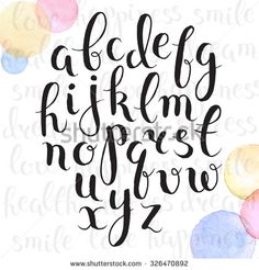 a handwritten alphabet with watercolor circles