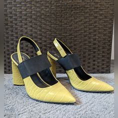 Textured Greenish Yellowish Pumps. Brand New, Never Worn. Feature Stretchy Black Strap. Pointed Toe For A Classic Look. Match Perfectly With Blazer In My Store! Yellow Pointed Toe Slingback Pumps For Summer, Yellow Pointed Toe Slingback Pumps For Spring, Yellow Slingback Pumps With Heel Strap For Spring, Spring Yellow Slingback Pumps With Heel Strap, Spring Yellow Slingback Strap Pumps, Spring Yellow Slingback Pumps, Chic Yellow Slingback Pumps For Spring, Yellow High Heel Slingback Pumps For Summer, Yellow Slingback Pumps For Spring