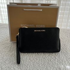 Brand New Authentic Michael Kors Jet Set Travel Wristlet Wallet. Black Color With Gold Hardware. With Tags. Comes With Michael Kors Shopping Bag (As Shown In Pic) Elegant Michael Kors Clutch For Travel, Michael Kors Rectangular Clutch For Travel, Everyday Michael Kors Rectangular Clutch, Michael Kors Rectangular Everyday Clutch, Michael Kors Elegant Clutch Wallet, Elegant Michael Kors Clutch Wallet, Michael Kors Shopping Bag, Michael Kors Travel Wallet Rectangular, Luxury Michael Kors Travel Wallets