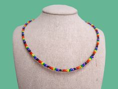 this discrete inclusive pride flag seed bead necklace is the cutest accessory for celebrating your pride and allegiance! this necklace is absolutely perfect for those who are out-and-proud and for those who are still in the closet! <3 **packaging is completely discreet * the item(s) you receive will always be slightly different from the picture since every item is custom, unique, and handmade to order. please allow for small variations in each product * necklace length: 14in + 2in chain extender Rainbow Necklaces With Tiny Beads For Festivals, Adjustable Rainbow Necklaces With Spacer Beads, Rainbow Tiny Beads Necklace For Festivals, Handmade Rainbow Necklaces For Everyday Wear, Handmade Rainbow Necklaces For Everyday, Adjustable Jewelry For Pride Festival Gift, Handmade Rainbow Necklace For Everyday, Rainbow Letter Beads Necklace For Festivals, Multicolor Jewelry For Pride Gift