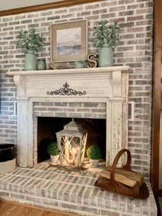 the fireplace is decorated with candles and potted plants