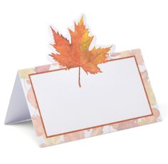 a card with a maple leaf on it