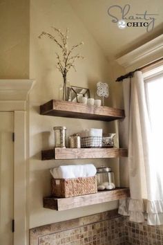 some shelves in the corner of a bathroom