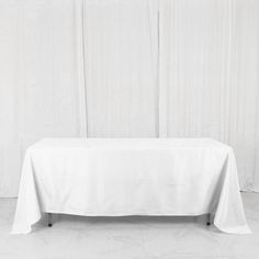 a white table cloth on top of a wooden table