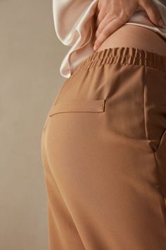 Full-length trousers featuring two pockets, faux back pocket and covered elasticated waist. Stretch Pants With Pockets For Business Casual, Versatile Business Casual Pants With Elastic Waistband, Trousers With Pockets For Everyday, Everyday Trousers With Pockets, Casual Workwear Pants With Elastic Waistband, High-waisted Pants With Elastic Cuffs, Solid High-waisted Pants With Elastic Cuffs, Stretch Bottoms With Pockets For Business Casual, Versatile Ankle-length Bottoms With Pockets