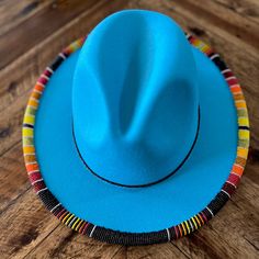 This Is A Beautiful One Of A Kind Hand Beaded, Original Designed Southwest Hat. Beautiful Turquoise Hat With Red Underlay.Over 2000 Beads Hand Sewn.One Size Fits All Has Drawstring On Inner Lining To Fit Any Size Head Made Of Cotton And Polyester. [Built-In Adjustable Strap] The Circumference Of The Wide Brim Fedora Hat: 56-58cm/22"-22.8", The Brim Width: 7.5 Cm/2.95 ".Has An Adjustable Drawstring Inside, Suitable For Most Men And Women , You Can Adjust It According To Your Own Size To Meet Your Blue Beaded Hat Bands For Festival, Adjustable Beaded Blue Hat, Adjustable Blue Beaded Hat, Handmade Blue Hat Bands With Curved Brim, Bohemian Blue Beaded Hat, Blue Bohemian Beaded Hat, Traditional Fitted Blue Hat, Turquoise Beaded Beach Hat, Traditional Blue Hat With Curved Brim