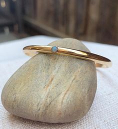 The Gemmed Half Round cuff bangle custom jewelry gem bracelet opal turquoise gemstone birthstone bra Dainty Adjustable Cuff Bracelet For Anniversary, 14k Gold Birthstone Jewelry Adjustable, Everyday Gold Opal Jewelry, Adjustable Stackable Cuff Bracelet For Anniversary, Stackable Brass Jewelry Gift, Adjustable Heirloom Bangle As Gift, Adjustable Heirloom Style Bracelet As Gift, Adjustable Heirloom Style Bracelet For Gifts, Heirloom Style Adjustable Bangle As Gift