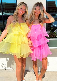 Final Sale Twirl into summer with the Natalia dress, a flirty tiered ruffle mini that comes in sunshine yellow or bubblegum pink. 100% Polyester Hand wash cold Hang dry Back zipper Model in Pink: Meet Brae! Height: 5’7” Hips: 35” Bust:34” Waist: 25” Wearing Size: Small Model in Yellow: Meet Harley! Height: 5’8” Hips: 34" Waist: 26” Bust: 33" Wearing Size: Small Bright Color Dress Party, Bright Color Dress, Pink Shoot, 21 Bday, Strapless Organza, Fun Dresses, Pretty Bridesmaid Dresses, Bright Color Dresses, Style Evolution