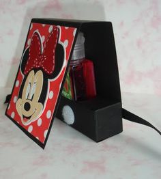 a minnie mouse card holder is shown on a table