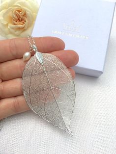 This delicate real leaf pendant with a beautiful freshwater pearl was originally a custom order from a close friend who was planning her autumnal wedding. She wanted her bridesmaid's jewellery to match her autumnal leaf theme and colours.  You can choose between a rose gold plated or silver plated finish on the leaf pendant. The necklaces come in a cardboard box wrapped in a ribbon. If you would like to add a personalised message or would like to customise this piece in any way please get in touch. Leaf Necklace Silver, Rose Gold Leaf, Gold Leaf Pendant, Real Leaf, Real Pearl Necklace, Real Leaves, Necklace Rose Gold, Pearl Hair Pins, Necklace Bridal