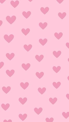 a pink background with lots of hearts on it