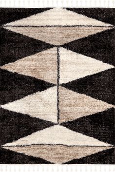 a black and white rug with an abstract design on the bottom, in two different colors