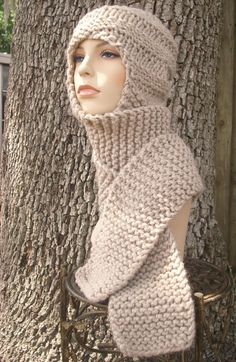 a mannequin wearing a knitted hat and scarf