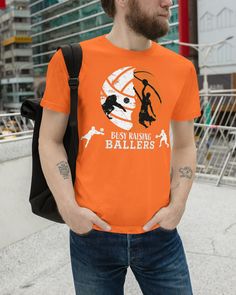 a man wearing an orange t - shirt with the words easy raising ballers on it