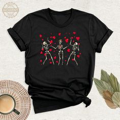 Valentines Day Dancing Skeletons Shirt, Sarcastic Gift Little Red Hearts Tshirt, Valentine Funny Outfit, Funny Skeleton Birthday Gift Shirt. Welcome to BestMomentTees! Step into a world of comfort and style with our handmade shirts from the renowned Bella Canvas brand. The solid colors are 100% pure cotton, while the delightful heather colors are a charming blend of 52% cotton and 48% polyester. 🍃 Each shirt is a true labor of love, meticulously created using the innovative DTF printing method. Fun Red T-shirt, Black Top With Heart Graphic As Gift, Red Crew Neck Top For Gift, Black Short Sleeve T-shirt For Valentine's Day, Casual Halloween T-shirt For Gift, Black Casual Shirt For Valentine's Day, Casual Black Shirt For Valentine's Day, Red Graphic Print Top As Gift, Casual Tops For Birthday And Valentine's Day