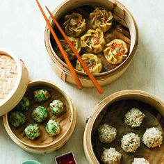 three wooden containers filled with food and chopsticks