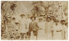 an old black and white photo of people in hats