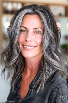 Cool Gray Mixed With Midnight Waves Medium-Length Hairstyle on a smiling woman. Blending Gray Hair With Dark Brown, Gray Blending For Brunettes, Dark And Gray Hair, Dark Hair With Grey Blending, Dark Hair Platinum Highlights, Dark Hair Silver Highlights, Grey Streaks In Dark Hair, Blended Grey Hair Highlights, Brunette Going Gray