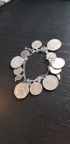 A very nice bracelet for every occasion. It will be sent in a fine jewelry pouch. More in my shop: https://www.etsy.com/de/shop/CoinCraftShop Vintage Handmade Round Chain Bracelet, Handmade Vintage Round Chain Bracelet, Metal Coin Bracelets For Gift, Metal Coin Bracelets As Gifts, Nickel-free Coin-shaped Bracelets As Gifts, Handmade Metal Jewelry With Coin Shape, Silver Bracelets With Coin Pendant For Gift, Silver Bracelets With Coin Pendant As Gift, Handmade Metal Charm Bracelet