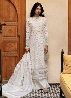 Farah Talib Aziz Ourika Ivory Summer Lawn Original brand suit fabric and photography lite diffrance in actual print. Festive Off White Sets With Printed Motifs, Festive Off-white Printed Sets, Festive Off-white Sets With Printed Motifs, Bohemian Cream Set With Dupatta, Bohemian Cream Sets With Dupatta, Bohemian Cream Wedding Sets, Semi-stitched White Unstitched Suit With Naqshi, Bohemian Cream Sets For Eid, Traditional Cream Sets With Printed Motifs