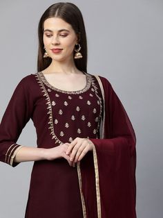 PRODUCT DETAILS Maroon embroidered Kurta with Palazzos with dupattaKurta design: Geometric embroidered Straight shape Regular style Round neck, three-quarter regular sleeves Gotta patti detail Calf length with a straight hem Cotton blend machine weave fabric Palazzos design: Embroidered Palazzos Elasticated waistband Slip-on closure Comes with dupatta Size & Fit Dupatta length: 2.25 metersDupatta width: 95 cmThe model (height 5'8) is wearing a size S Please check the last image above for a compl Designer Churidar With Embroidered Border, Dola Silk Anarkali Set With Embroidered Border, Festive Embroidered Sharara With Straight Kurta, Embroidered Border Sharara For Eid, Dola Silk Straight Kurta With Embroidered Border, Chanderi Set With Embroidered Border And Straight Kurta, Straight Dola Silk Kurta With Embroidered Border, Diwali Sharara With Embroidered Border And Straight Kurta, Embroidered Chinon Kurta, Straight Cut