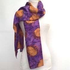 "Hand woven and hand painted pure silk scarf with hand-rolled edges.  This silk scarf is painted in a rich purple with gold tan in a water-effect finish.  This technique allows the colours to gently merge and creates a rippled water effect. In a medium weight silk - about twice as thick as my other hand-painted silk scarves in Habotai silk. The silk is hand woven and then painted by artisans in Northern India who are members of a fair trade organisation.  This organisation was set up to help dis Hand Dyed Purple Silk Scarves, Artistic Purple Silk Scarves, Artistic Purple Silk Scarf, Purple Silk Bohemian Scarves, Purple Bohemian Silk Scarf, Rippled Water, Purple Silk Scarf, Pink Silk Scarf, Long Silk Scarf