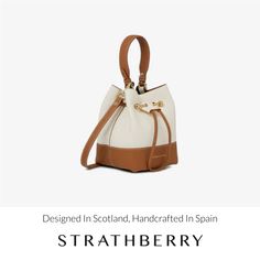 A modern take on the classic bucket bag, our best-selling osette is your perfect everyday companion. Deceptively spacious, the soft structure is handcrafted in spain and features an elegant drawstring closure, complete with our signature music bar. This compact yet versatile silhouette can be carried in hand by the leather top-handle, or styled as a crossbody bag with the detachable leather strap - for elegant ease in your everyday. Luxury Daily Use Bucket Bag, Luxury Bucket Backpack For Daily Use, Luxury Bucket Bag With Detachable Strap For Daily Use, Luxury Shopping Bucket Bag With Adjustable Strap, Luxury Pouch Bucket Bag, Luxury Pouch Bucket Bag For Daily Use, Luxury Bucket Bag With Detachable Strap For Everyday, Luxury Bucket Bag With Leather Handles For Shopping, Luxury Shopping Bucket Bag With Leather Handles