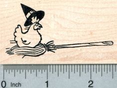 a rubber stamp with a drawing of a man in a hat on top of a boat