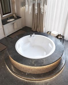 a bath tub sitting on top of a bathroom counter