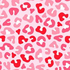 a pink and red leopard print pattern with hearts