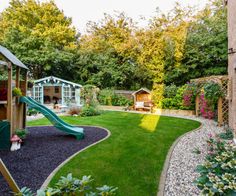 a backyard with a play area and green grass