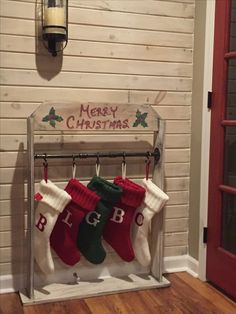 stockings hanging on a rack in front of a door