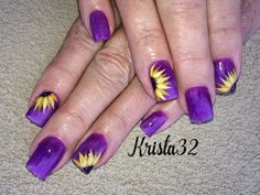 two hands with purple and yellow nail designs