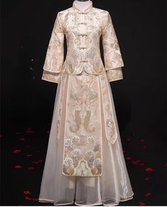 Looking a traditional Chinese bridal gown. This beautiful 2-piece Qun Kwa set is embroidered with gold, silver and white threads. The intricate flower and cloud embroideries are decorated throughout the jacket and skirt. The Tulle skirt give the traditional outfit a modern touch. It's a perfect option for your traditional Chinese wedding, tea ceremony Please note: Asian size run small , please refer to the size guide picture before placing the order. This Qun Kwa Dress for Bride size available f Festive Gown With Gold Embroidery For Traditional Ceremonies, Traditional Sets With Gold Embroidery For Ceremony, Ceremonial Gown With Gold Embroidery, Gold Traditional Drape Ceremonial Gown, Elegant Gold Embroidered Wedding Dress, Traditional Ceremony Sets With Gold Embroidery, Traditional Gold Gown For Ceremonial Occasions, Traditional Gold Wedding Dress With Intricate Embroidery, Traditional Gold Embroidered Festive Dress