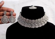 * SIlver choker necklace Set with earrings Tikka as shown in the pic. * Studded with crystals and rhinestones. * One of a Kind. *No.1- Silver *Necklace Width- 1.2 inches * Earrings Length: 1.9 inches(included drops) *Earrings Breadth- 1.1 inches Indian Choker Necklace Set, Nath Bridal, Necklace Set Silver, Silver Jewellry, Indian Choker, Indian Choker Necklace, Choker Silver, Indian Nose Ring, Necklace Set Indian