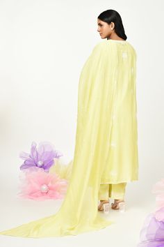 Yellow chanderi kurta with thread embroidery in floral placement pattern. Paired with cotton pant, inner and dupatta.
Components: 4
Pattern: Embroidery
Type Of Work: Thread, floral
Neckline: Round
Sleeve Type: Three quarter
Fabric: Chanderi
Color: Yellow
Other Details: 
Front button detailing
Lace embellished border
Embroidery on pant hem
Note: Potli shown in the image is not for sale
Occasion: Puja - Aza Fashions Festive Cotton Palazzo Set With Sheer Dupatta, Cotton Sharara With Sheer Dupatta For Festivals, Cotton Sharara With Sheer Dupatta For Eid, Traditional Cotton Kurta With Sheer Dupatta, Designer Cotton Palazzo Set With Sheer Dupatta, Unstitched Cotton Kurta With Sheer Dupatta, Cotton Salwar Kameez With Sheer Dupatta For Navratri, Cotton Palazzo Set With Sheer Dupatta For Navratri, Cotton Sets With Sheer Dupatta For Festivals