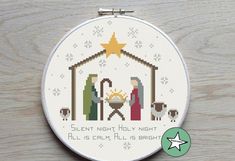 a cross stitch christmas nativity scene with the birth of jesus